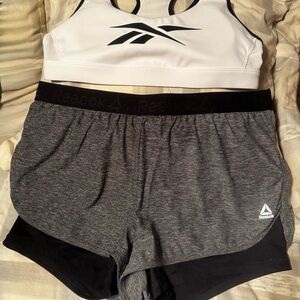Reebok Women's Athletic Shorts and Sports Bra set in Gray, Black, and White.